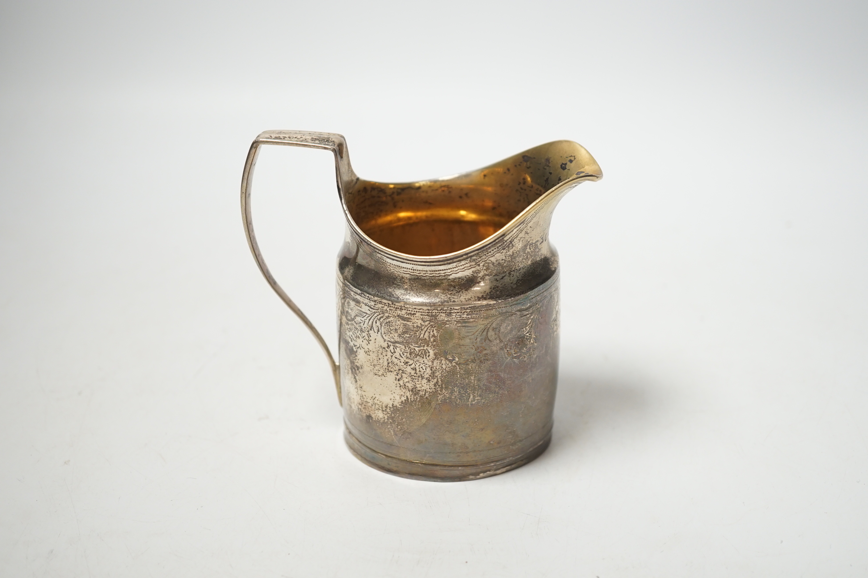 A George III silver cream jug, marks rubbed, 10.3cm.